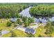 Aerial view of the property, nestled next to a body of water and surrounded by trees at 4074 Center Rd., Georgetown, SC 29440