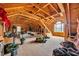 Spacious unfinished attic space with wood beams and a window at 4074 Center Rd., Georgetown, SC 29440