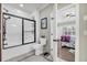 Bathroom featuring a glass shower and view into the primary bedroom at 4074 Center Rd., Georgetown, SC 29440