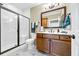 Bathroom with a glass-enclosed shower and a wood vanity with a large mirror at 4074 Center Rd., Georgetown, SC 29440