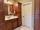 Bathroom features wood cabinets, drawers and door, and light marble look tile flooring at 4074 Center Rd., Georgetown, SC 29440