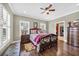 Bedroom featuring a ceiling fan, hardwood floors, and many windows for lots of natural light at 4074 Center Rd., Georgetown, SC 29440