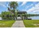 Exterior view of a covered dock with a peaceful waterfront backdrop and serene sky at 4074 Center Rd., Georgetown, SC 29440
