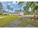 Attractive home features a charming wrap-around porch, a well-manicured lawn, and a long driveway at 4074 Center Rd., Georgetown, SC 29440