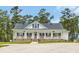 Beautiful one-story home boasts a covered front porch and neat landscaping at 4074 Center Rd., Georgetown, SC 29440