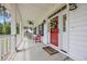 Inviting front porch featuring comfortable seating, a ceiling fan, and charming decorative touches at 4074 Center Rd., Georgetown, SC 29440