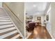 Staircase to the second floor next to a view of the living room with a fireplace at 4074 Center Rd., Georgetown, SC 29440