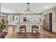 Kitchen island with bar stool seating, stainless steel appliances, and custom cabinets at 4074 Center Rd., Georgetown, SC 29440