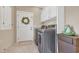 Functional laundry room with modern appliances and built-in storage cabinets at 4074 Center Rd., Georgetown, SC 29440