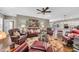 Inviting living room featuring leather furniture, hardwood floors, and a ceiling fan at 4074 Center Rd., Georgetown, SC 29440