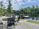 Charming waterfront property featuring a cozy outdoor dining area with a covered dock perfect for enjoying tranquil water views at 4074 Center Rd., Georgetown, SC 29440