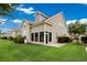 Exterior view of home highlighting the screened porch and the well-maintained yard at 4355 Willoughby Ln. # 401, Myrtle Beach, SC 29577