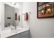 Bathroom featuring a vanity, mirror and a beach themed art piece at 4355 Willoughby Ln. # 401, Myrtle Beach, SC 29577
