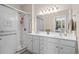 Bathroom featuring a double sink vanity, a large mirror and a walk-in shower at 4355 Willoughby Ln. # 401, Myrtle Beach, SC 29577