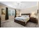 Comfortable bedroom featuring a ceiling fan and large window for natural light at 4355 Willoughby Ln. # 401, Myrtle Beach, SC 29577