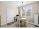 Sunny dining area with access to the entry door and views of the yard at 4355 Willoughby Ln. # 401, Myrtle Beach, SC 29577