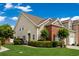 Beautiful townhouse with a combination of siding and brick exterior, well-manicured lawn and mature trees at 4355 Willoughby Ln. # 401, Myrtle Beach, SC 29577