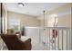 Hallway with two chairs, white railings and an open view to the area below at 4355 Willoughby Ln. # 401, Myrtle Beach, SC 29577