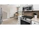 Well-equipped kitchen features stainless steel appliances, backsplash, and adjacent dining area at 4355 Willoughby Ln. # 401, Myrtle Beach, SC 29577