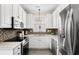Modern kitchen featuring stainless steel appliances, granite countertops, and ample cabinetry at 4355 Willoughby Ln. # 401, Myrtle Beach, SC 29577