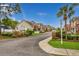 Charming street view of townhouses featuring landscaped greenery and brick entryways at 4355 Willoughby Ln. # 401, Myrtle Beach, SC 29577