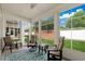 Bright sun room with multiple windows and a ceiling fan overlooks the backyard at 4355 Willoughby Ln. # 401, Myrtle Beach, SC 29577