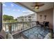 Beautiful balcony with seating and ceiling fan overlooking the community pool and golf course at 4737 Wild Iris Dr. # 203, Myrtle Beach, SC 29577