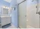 Bright bathroom featuring a glass-enclosed shower, vanity with storage, and modern fixtures at 4737 Wild Iris Dr. # 203, Myrtle Beach, SC 29577