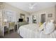 Bright bedroom features a comfortable bed, a desk, and an ensuite bathroom for added convenience at 4737 Wild Iris Dr. # 203, Myrtle Beach, SC 29577