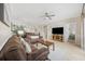 Open concept living room with wood floors, comfy seating, kitchen with dining area and large TV at 4737 Wild Iris Dr. # 203, Myrtle Beach, SC 29577
