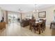 Bright living room featuring a sliding glass door leading to a balcony and an adjacent dining area at 4737 Wild Iris Dr. # 203, Myrtle Beach, SC 29577