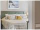 Cozy bedroom features a large bed with decorative pillows and a view of the outside at 4737 Wild Iris Dr. # 203, Myrtle Beach, SC 29577