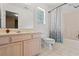 Bright bathroom featuring a large vanity, toilet, and shower with curtain at 480 Dandelion Ln., Myrtle Beach, SC 29579