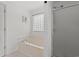 Clean bathroom with a bathtub, shower, and a frosted glass block window for natural light and privacy at 480 Dandelion Ln., Myrtle Beach, SC 29579