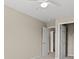 Bright, empty bedroom with beige walls, a ceiling fan, neutral carpet, and two doors at 480 Dandelion Ln., Myrtle Beach, SC 29579