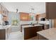 Modern kitchen featuring a center island, granite countertops, stainless steel appliances, and contemporary lighting at 480 Dandelion Ln., Myrtle Beach, SC 29579