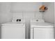 Convenient laundry area features a washer, dryer, and storage shelf at 480 Dandelion Ln., Myrtle Beach, SC 29579