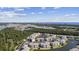 Panoramic aerial view of condo community with a lake and the ocean visible in the distance at 4828 Magnolia Lakes Dr. # 404, Myrtle Beach, SC 29577