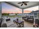 Relaxing balcony with comfortable seating and a picturesque lake view at sunset at 4828 Magnolia Lakes Dr. # 404, Myrtle Beach, SC 29577