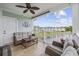 Cozy covered patio area with comfortable seating and scenic water views at 4828 Magnolia Lakes Dr. # 404, Myrtle Beach, SC 29577