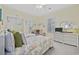 Comfortable bedroom featuring two beds with decorative comforters and a white wicker dresser at 4828 Magnolia Lakes Dr. # 404, Myrtle Beach, SC 29577