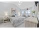 Bright bedroom with large bed, bay windows, and stylish nautical decor at 4828 Magnolia Lakes Dr. # 404, Myrtle Beach, SC 29577