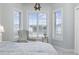Cozy bedroom corner with a comfy chair and scenic views from multiple windows at 4828 Magnolia Lakes Dr. # 404, Myrtle Beach, SC 29577