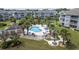 Resort-style pool with lounge chairs and lush landscaping surrounded by well-maintained condo buildings at 4828 Magnolia Lakes Dr. # 404, Myrtle Beach, SC 29577