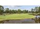 Picturesque view of lush green golf course with a meandering creek at 4828 Magnolia Lakes Dr. # 404, Myrtle Beach, SC 29577