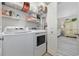 Well-organized laundry room with modern washer and dryer and ample storage space at 4828 Magnolia Lakes Dr. # 404, Myrtle Beach, SC 29577
