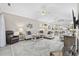 Spacious living room with comfortable seating, vaulted ceilings, and adjacent kitchen and dining areas at 4828 Magnolia Lakes Dr. # 404, Myrtle Beach, SC 29577