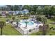 Aerial view of fenced in community pool with mature landscaping at 4828 Magnolia Lakes Dr. # 404, Myrtle Beach, SC 29577
