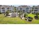 Aerial view of community pool area with picnic tables and lounge chairs at 4828 Magnolia Lakes Dr. # 404, Myrtle Beach, SC 29577