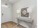 Bright entryway with a light gray console table, decorative mirror, and two stylish white lamps at 489 Blissful Ln., Little River, SC 29566